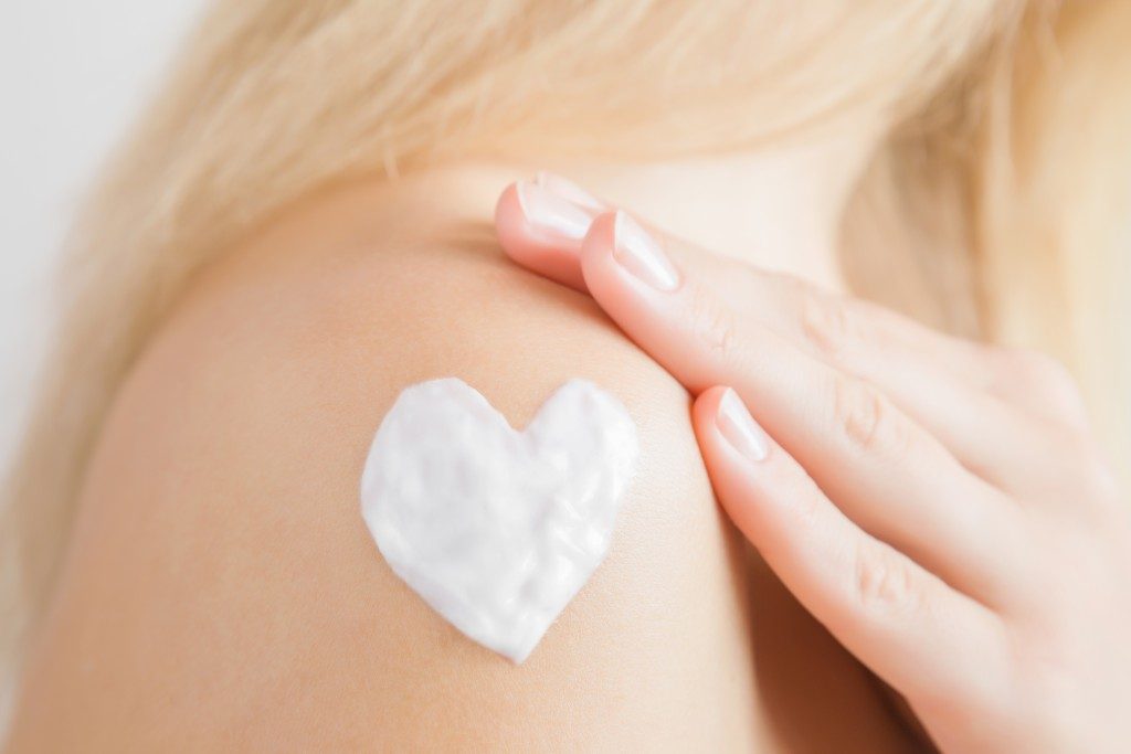 moisturizer lotion shaped heart on shoulder