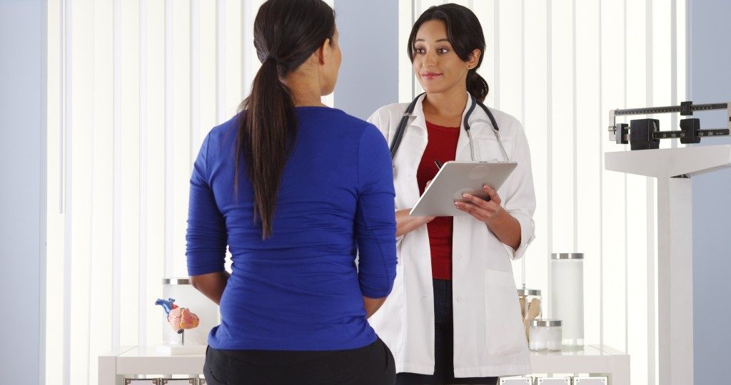 woman consulting a gynecologist