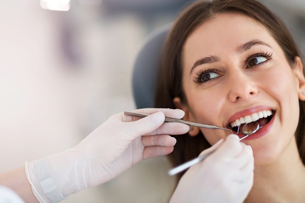 woman having her teeth checked
