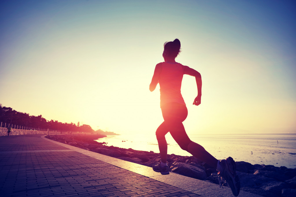 woman running during sunset