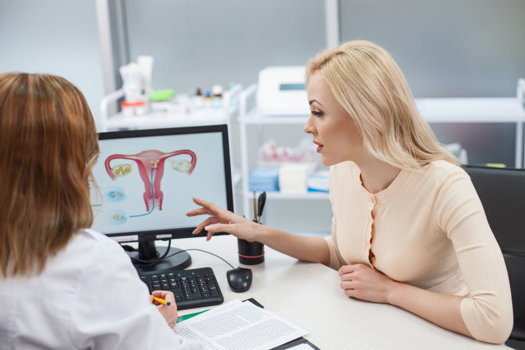 A woman consulting with a gynecologist in a clinic