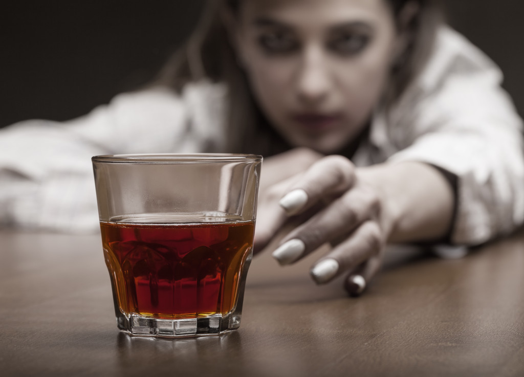 A woman struggling with alcohol abuse