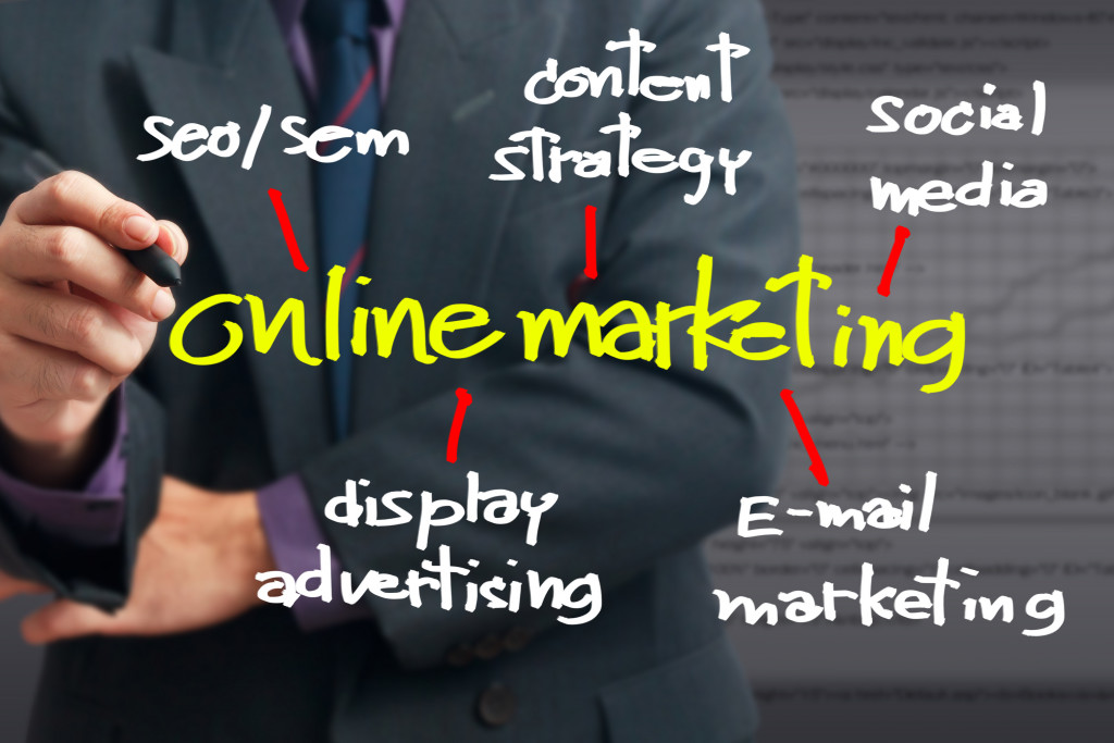 a businessman writing online marketing concept