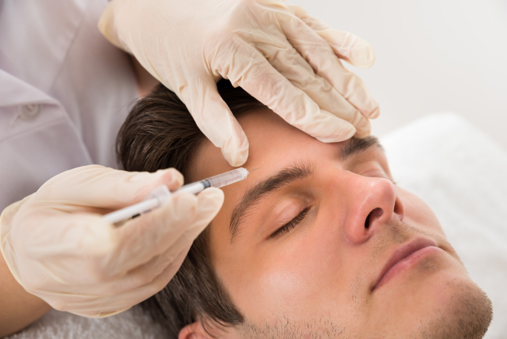 A man getting cosmetic procedure