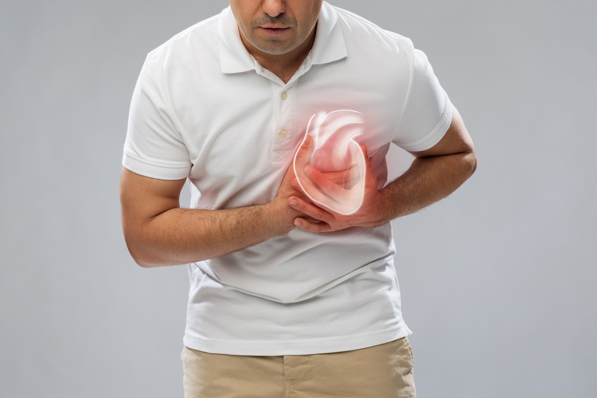 close up of middle-aged man having heart attack